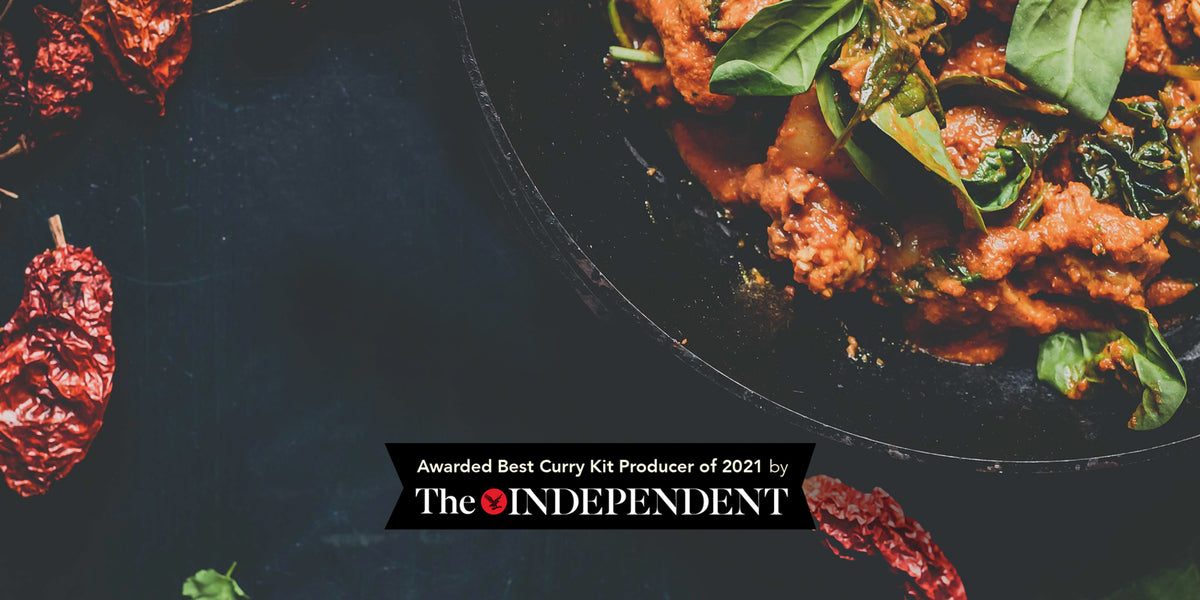 Picture of a cooked curry in a pan with an award from the Independent News Paper for Best Curry Kit